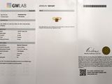 a white paper with a gold ring on top of it