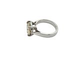 a close up of a diamond ring on a white background