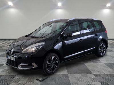 the black car is parked on a checkered tile floor