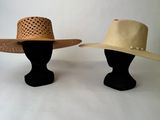 two hats on a mannequin head on a white background