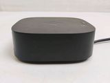 an image of a black device sitting on top of a white table
