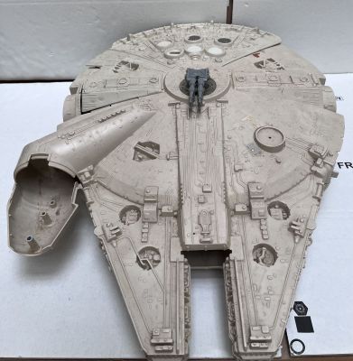 a model of a star wars millennium war vehicle on a table