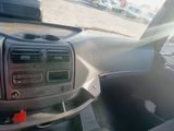 a dashboard of a car with the sun shining through the windshield