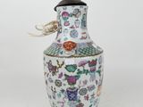 an image of a white vase with a colorful design on it