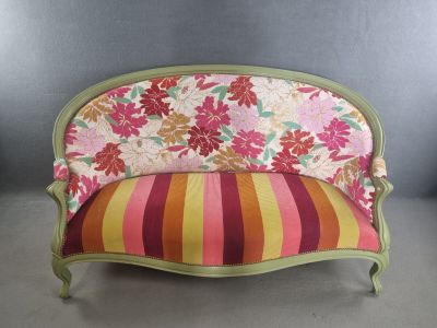 a couch with a colorful floral pattern on it