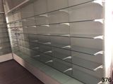 a glass display case in the middle of a store