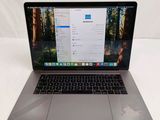 an apple macbook pro laptop with a keyboard and mouse sitting on a table