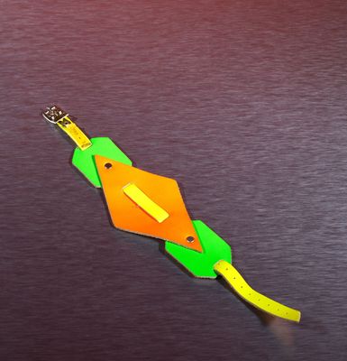 a paper kite that is shaped like an orange and green kite