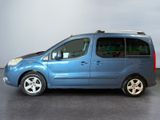 a blue van that is parked in a room