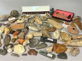 a pile of rocks and other items on a table