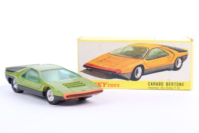 a toy car that is sitting in front of a box