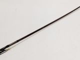 an image of a long stick on a white surface