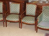 six chairs and a table in a room
