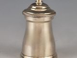 a silver container with a lid on a table