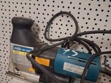 a picture of a corded sander on a shelf in a store