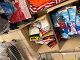 a box full of socks and other items on the floor