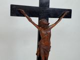 a statue of jesus on a cross on a table