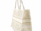 an image of a white and beige tote bag on a white background