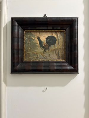 a picture of a painting hanging on the wall