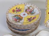 a lot of plates that are sitting on a table