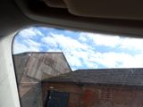 a view of a building through the window of a car