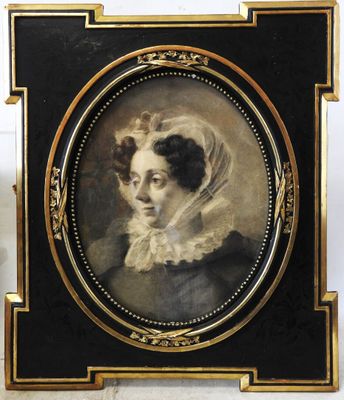an old picture of a woman with a veil on her head