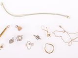 many different types of jewelry on a white surface