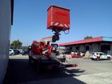 a crane that is sitting on the back of a truck
