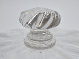 a glass plate with a glass knob on top of it
