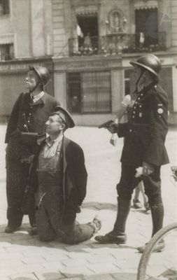 a black and white photo of a group of men on the street