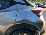 a close up of a car parked on the side of the road
