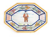 une assiette sur laquelle est représenté un homme en costume