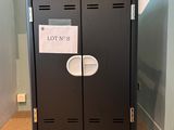 a black locker with a lot of labels on it