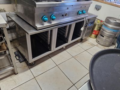 a kitchen with a stove, oven, and other appliances in it