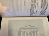 an open book with a picture of a building on it