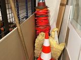a pile of construction materials and a cone in the corner of a room