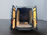 a black van with its doors open on a black floor