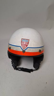 an image of a white helmet with an orange and blue stripe