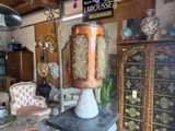 a large vase sitting on top of a pedestal in a room