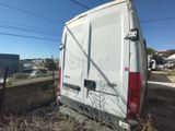 a white van that is parked on the side of the road
