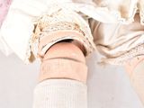 a close up of a person ' s legs with a pair of socks