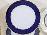 a lot of plates that are sitting on a table