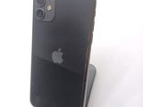 a black iphone sitting on top of a stand