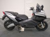 a picture of a motorcycle parked on a checkered floor