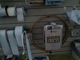 a clock on the wall in a sewing shop