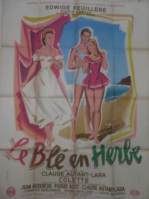 une vieille affiche de cinéma représentant deux femmes en maillot de bain sur la plage