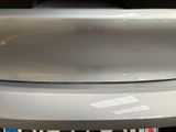 a close up of a car ' s bumper with a sticker on it