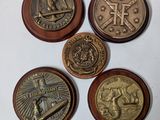 four different types of coins on a white surface