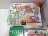 a box of monopoly cards and a box of monopoly cards on a table