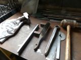 many different types of tools sitting on a workbench